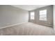 Neutral bedroom with carpet, neutral walls, and natural light from two windows at 4241 Risen Star Way, Bargersville, IN 46106