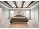 Spacious bedroom featuring decorative beams, neutral walls, large windows and carpet at 4241 Risen Star Way, Bargersville, IN 46106