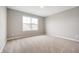 This bedroom features neutral carpet, gray walls, and a large window offering plenty of natural light at 4241 Risen Star Way, Bargersville, IN 46106