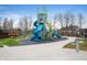Inviting playground with slides, climbing structures, and soft turf, providing a safe and fun recreational area at 4241 Risen Star Way, Bargersville, IN 46106