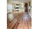Open-concept living space with hardwood floors and natural light flowing into the kitchen area at , Indianapolis, IN 46201