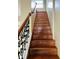 Staircase with wooden steps, iron railing, leading to the upper levels of the home at , Indianapolis, IN 46201