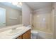 Bathroom with a tub/shower combo, vanity with sink and a toilet at 4655 Welton St, Greenwood, IN 46143