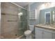 Bathroom featuring a glass enclosed shower, granite countertop and modern fixtures at 4655 Welton St, Greenwood, IN 46143