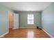 Comfortable bedroom with laminate wood floors and closet storage space at 4655 Welton St, Greenwood, IN 46143