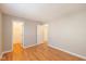 Neutral bedroom with two doorways and laminate wood floors at 4655 Welton St, Greenwood, IN 46143