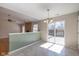 Bright dining area with sliding glass doors to a deck and open to the living room at 4655 Welton St, Greenwood, IN 46143