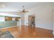 Open-concept living area flows seamlessly into the eat-in kitchen with a fireplace at 4655 Welton St, Greenwood, IN 46143
