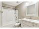 Updated bathroom featuring a tub shower combination and white vanity with countertop sink at 4911 Carry Back Ln, Indianapolis, IN 46237