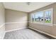 Empty bedroom with large window and views of the neighborhood at 4911 Carry Back Ln, Indianapolis, IN 46237