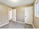 Empty bedroom showcasing updated flooring and neutral paint at 4911 Carry Back Ln, Indianapolis, IN 46237