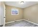 Cozy bedroom with gray vinyl flooring and natural light at 4911 Carry Back Ln, Indianapolis, IN 46237