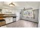 Charming kitchen featuring white cabinets, modern backsplash, and stainless steel dishwasher at 4911 Carry Back Ln, Indianapolis, IN 46237