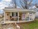 Inviting covered front porch with seating and decorative accents, creating a cozy outdoor space at 509 W Pierson St, Greenfield, IN 46140