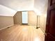 Comfortable bedroom with neutral tones, hardwood floors, and a window at 6045 N 300 W, Greenfield, IN 46140