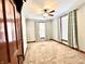 Inviting bedroom with soft carpet, natural light, and classic wood trim at 6045 N 300 W, Greenfield, IN 46140