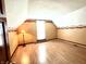 Charming bedroom featuring hardwood floors, a window, and decorative wallpaper border at 6045 N 300 W, Greenfield, IN 46140