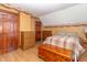 Cozy bedroom featuring wood doors, a dresser, and a decorative border on the walls at 6045 N 300 W, Greenfield, IN 46140
