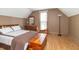 Inviting bedroom features a comfortable bed, dresser, and hardwood floors bathed in natural light at 6045 N 300 W, Greenfield, IN 46140
