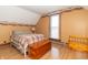 Bright bedroom with a plaid bedspread, wood chest and a decorative border on the walls at 6045 N 300 W, Greenfield, IN 46140