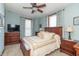 Cozy bedroom with wood furniture, ceiling fan, and natural light at 6045 N 300 W, Greenfield, IN 46140