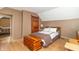 Charming bedroom featuring a cozy bed, wood trim, and a glimpse into an adjacent room at 6045 N 300 W, Greenfield, IN 46140