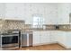 Sunny breakfast nook featuring built-in cabinets and a large window with views at 6045 N 300 W, Greenfield, IN 46140