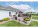 Spacious wooden deck featuring a grill, dining set, and charming flowerpots, perfect for outdoor entertaining and relaxation at 6045 N 300 W, Greenfield, IN 46140