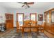 Inviting dining room featuring wood furniture, a ceiling fan, and a stylish patterned rug at 6045 N 300 W, Greenfield, IN 46140