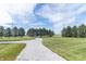 Long, winding gravel driveway leading to a peaceful and private property at 6045 N 300 W, Greenfield, IN 46140