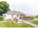 Charming home with a deck perfect for outdoor entertaining, mature trees and manicured lawn at 6045 N 300 W, Greenfield, IN 46140