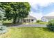 Charming home with a lovely front yard, inviting entryway, and well-manicured lawn at 6045 N 300 W, Greenfield, IN 46140