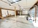Spacious two-car garage with overhead doors, ample lighting, and unfinished walls at 6045 N 300 W, Greenfield, IN 46140