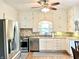 Modern kitchen with stainless steel appliances, granite countertops, and ample cabinet space at 6045 N 300 W, Greenfield, IN 46140