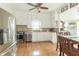 Bright kitchen showcasing stainless steel appliances, white cabinets, and a tiled backsplash at 6045 N 300 W, Greenfield, IN 46140