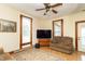 Inviting living room with hardwood floors, complemented by a comfortable sofa and a modern entertainment setup at 6045 N 300 W, Greenfield, IN 46140