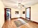 Bright living room featuring hardwood floors, a ceiling fan, and natural light at 6045 N 300 W, Greenfield, IN 46140