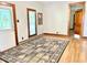 Charming living room features hardwood floors, a decorative rug, and natural light at 6045 N 300 W, Greenfield, IN 46140