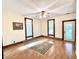 Bright living room with hardwood floors, natural light, and a ceiling fan at 6045 N 300 W, Greenfield, IN 46140