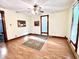 Spacious living room with hardwood floors, large windows, and charming wood trim at 6045 N 300 W, Greenfield, IN 46140
