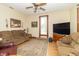 Relaxing living room with a spacious sofa, TV, and wood trim for a cozy atmosphere at 6045 N 300 W, Greenfield, IN 46140