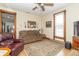 Inviting living room with hardwood floors, complemented by a comfortable sofa, a TV, and wood trim accents at 6045 N 300 W, Greenfield, IN 46140
