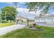 Well-manicured front yard with a charming flower display and beautiful landscaping, enhancing the curb appeal of the property at 6045 N 300 W, Greenfield, IN 46140