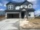 Charming two-story home featuring a two-car garage, gray siding, and a concrete driveway at 620 Corbin Way, Avon, IN 46123