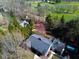 Aerial view of the property showcasing lush greenery, mature trees, and a well-maintained roof at 625 Mulberry St, Zionsville, IN 46077