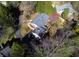 Bird's eye view of the home, revealing the roof, driveway, and surrounding trees at 625 Mulberry St, Zionsville, IN 46077