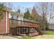 Brick house exterior with a large deck, brick patio, and backyard at 625 Mulberry St, Zionsville, IN 46077