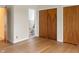 Bedroom featuring hardwood floors, closet space, and a glimpse into a bathroom at 625 Mulberry St, Zionsville, IN 46077