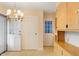 Cozy dining area featuring chandelier lighting and multiple doors for access at 625 Mulberry St, Zionsville, IN 46077