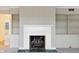 Living room fireplace with built-in shelving and cabinets at 625 Mulberry St, Zionsville, IN 46077
